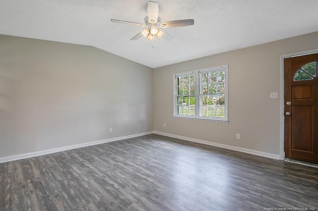 2304 Electra Rd, Fayetteville, NC 28304 - unfurnished room featuring dark wood-type flooring, ceiling fan, vaulted ceiling, and a textured ceiling