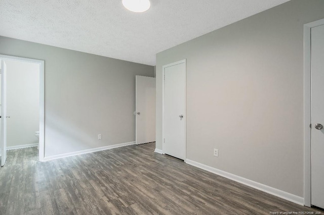 2304 Electra Rd, Fayetteville, NC 28304 - unfurnished bedroom featuring wood finished floors and a textured ceiling