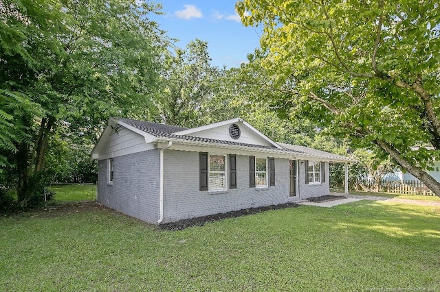 2304 Electra Rd, Fayetteville, NC 28304 - view of property exterior featuring a lawn and brick siding