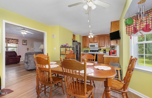 6408 Glen Brack Ct, Raleigh, NC 27603 - dining room with ceiling fan and light wood-type flooring