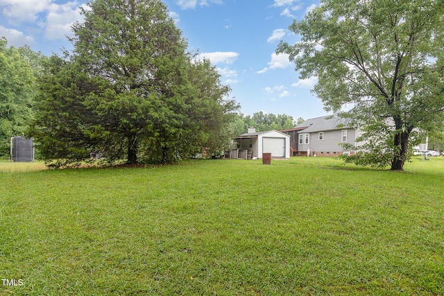 6408 Glen Brack Ct, Raleigh, NC 27603 - view of green lawn featuring a detached garage