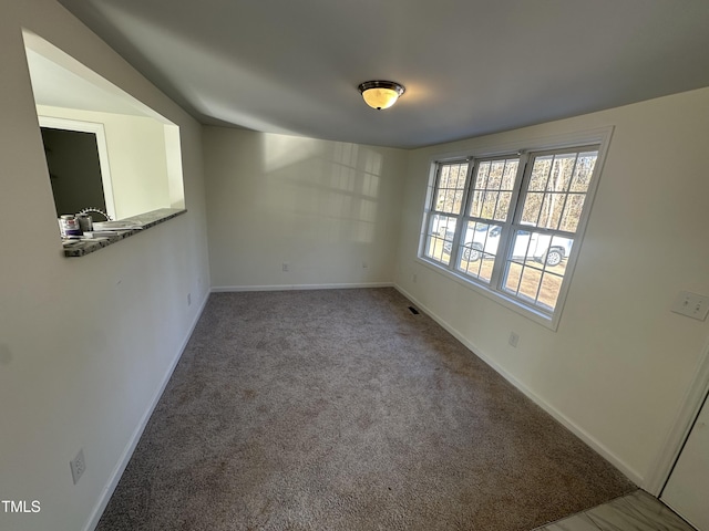 8505 Ray Rd, Raleigh, NC 27613 - empty room with baseboards and carpet