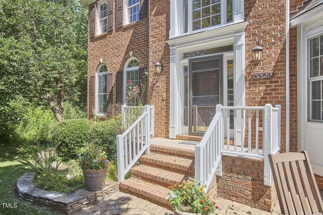 5328 Willow Cry Ln, Raleigh, NC 27613 - doorway to property featuring brick siding