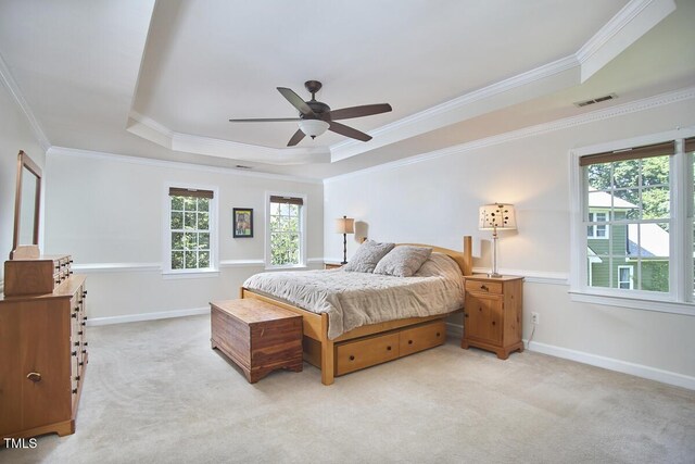 5328 Willow Cry Ln, Raleigh, NC 27613 - bedroom with a tray ceiling, crown molding, light colored carpet, and a ceiling fan