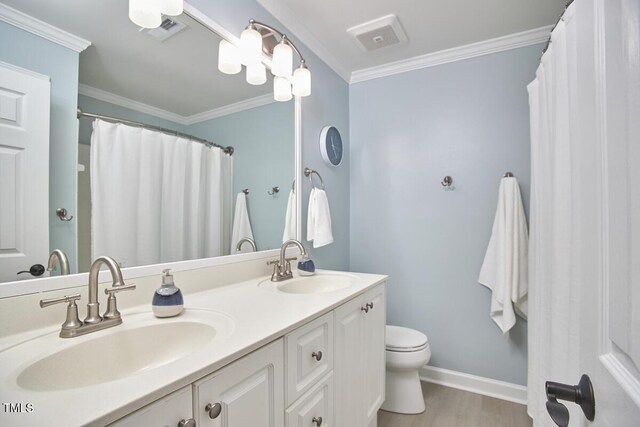 5328 Willow Cry Ln, Raleigh, NC 27613 - full bathroom with double vanity, wood finished floors, and crown molding