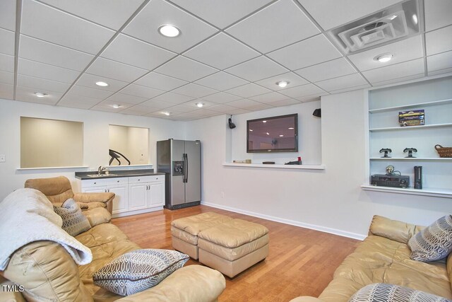 5328 Willow Cry Ln, Raleigh, NC 27613 - living room with light wood-style floors, recessed lighting, and built in shelves