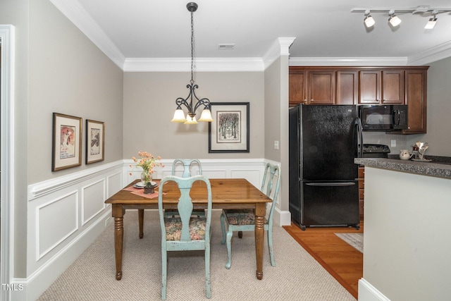734 Portstewart Dr, Cary, NC 27519 - dining room with crown molding, wainscoting, and light carpet