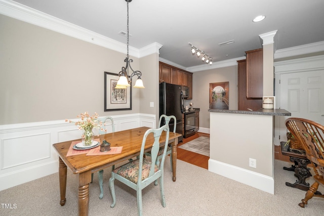 734 Portstewart Dr, Cary, NC 27519 - dining area with ornamental molding, light colored carpet, and wainscoting