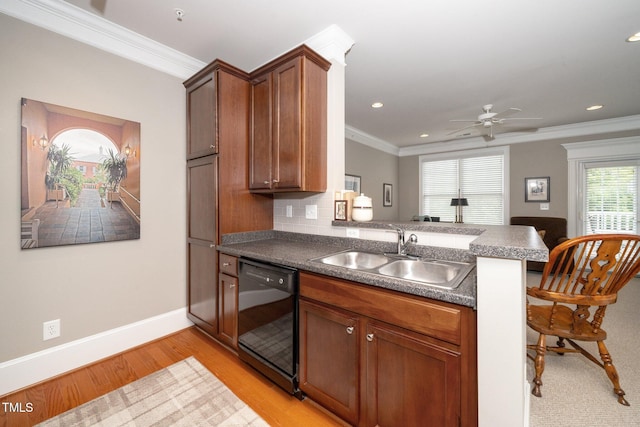 734 Portstewart Dr, Cary, NC 27519 - kitchen featuring black dishwasher, a peninsula, ornamental molding, light wood finished floors, and ceiling fan