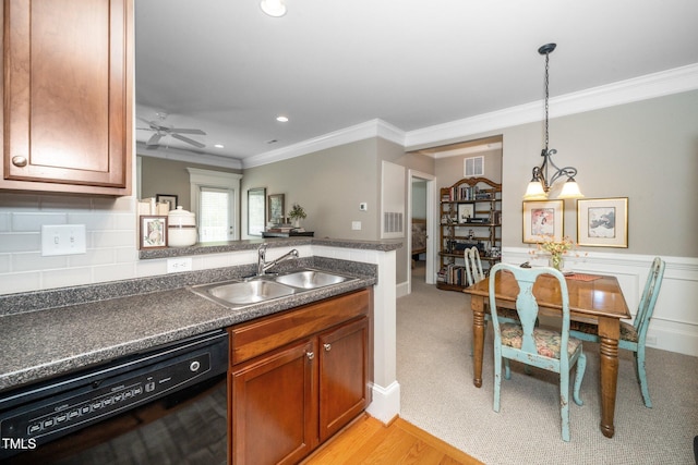 734 Portstewart Dr, Cary, NC 27519 - kitchen with dishwasher, crown molding, dark countertops, brown cabinetry, and ceiling fan