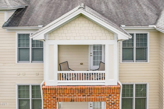 734 Portstewart Dr, Cary, NC 27519 - doorway to property with roof with shingles, a balcony, and an attached garage