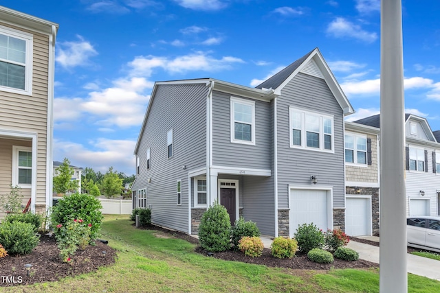 6549 Tremolo Trl, Raleigh, NC 27616 - view of front of property featuring a garage, driveway, and stone siding