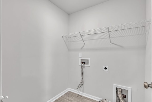 6549 Tremolo Trl, Raleigh, NC 27616 - laundry area featuring hookup for an electric dryer, hookup for a washing machine, and light wood-style floors