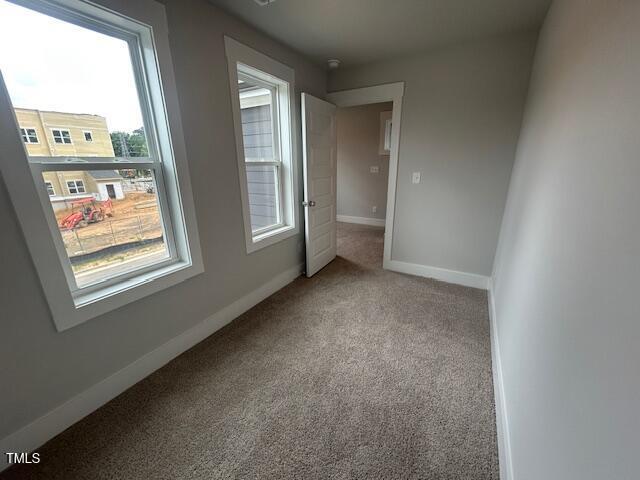 502 Yeowell Dr, Chapel Hill, NC 27514 - carpeted spare room with baseboards