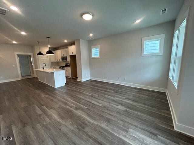 502 Yeowell Dr, Chapel Hill, NC 27514 - unfurnished living room with dark wood-style floors and recessed lighting