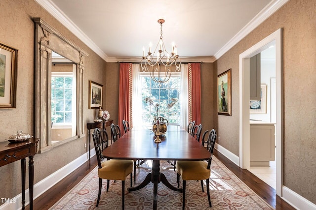 815 Marlowe Rd Unit 10, Raleigh, NC 27609 - dining area with a chandelier, dark wood finished floors, ornamental molding, and wallpapered walls