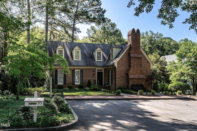 815 Marlowe Rd Unit 10, Raleigh, NC 27609 - cape cod-style house featuring brick siding and a chimney