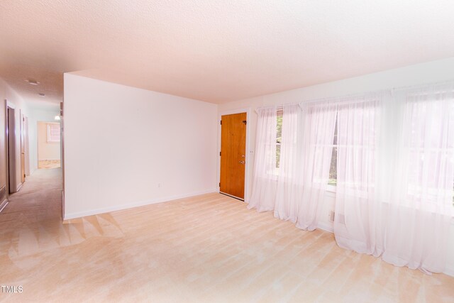 452 N Main St, Wendell, NC 27591 - spare room featuring light colored carpet and baseboards