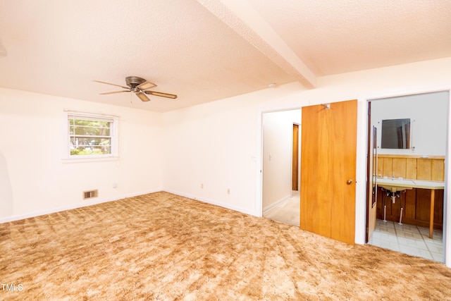 452 N Main St, Wendell, NC 27591 - spare room with ceiling fan, carpet floors, beam ceiling, and a textured ceiling