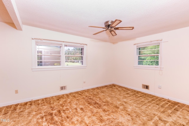 452 N Main St, Wendell, NC 27591 - spare room featuring a textured ceiling, carpet, and a ceiling fan