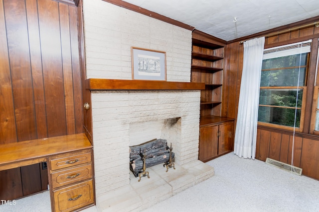 452 N Main St, Wendell, NC 27591 - living room with light colored carpet, wooden walls, and a fireplace