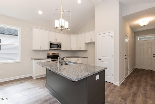 510 Branch St, Rocky Mount, NC 27801 - kitchen featuring appliances with stainless steel finishes, white cabinets, an island with sink, high vaulted ceiling, and recessed lighting