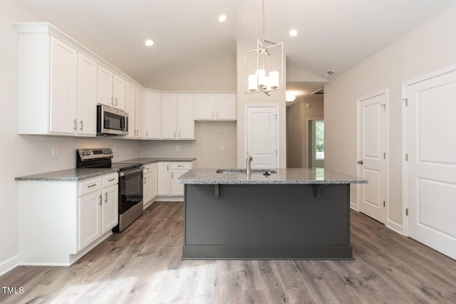 510 Branch St, Rocky Mount, NC 27801 - kitchen featuring stainless steel appliances, white cabinetry, lofted ceiling, light stone counters, and light wood-style flooring