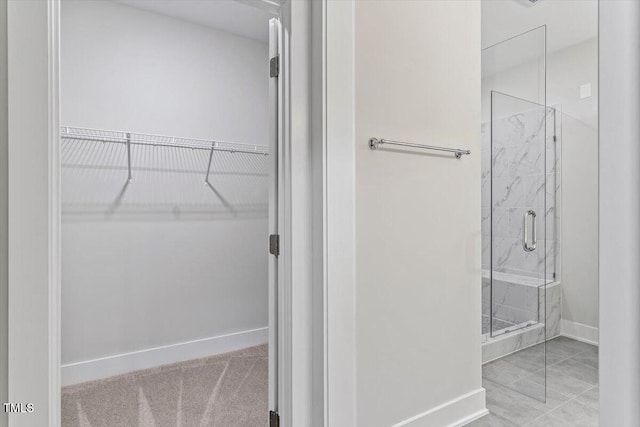 11548 Helmond Way # 104, Raleigh, NC 27617 - bathroom featuring a marble finish shower and a spacious closet