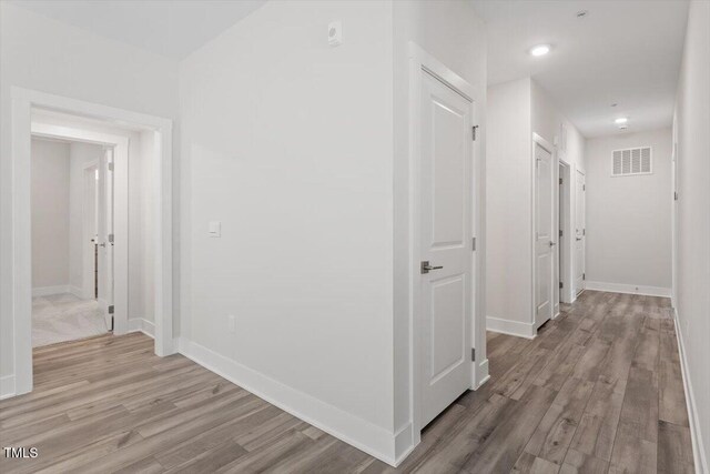 11548 Helmond Way # 104, Raleigh, NC 27617 - hall with light wood-style flooring and recessed lighting