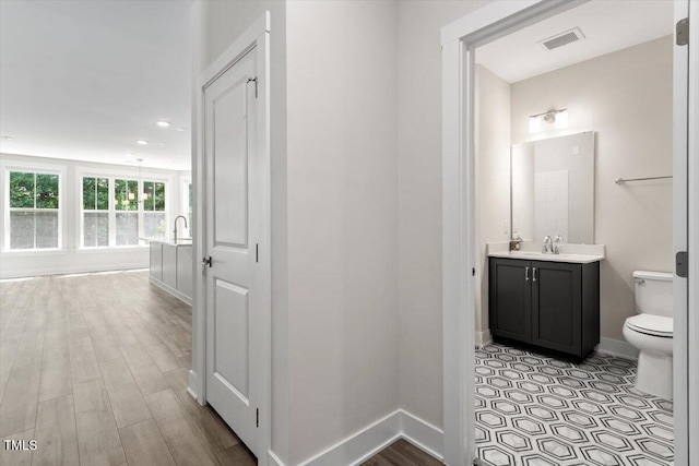 11548 Helmond Way # 104, Raleigh, NC 27617 - corridor featuring recessed lighting and light wood-style floors