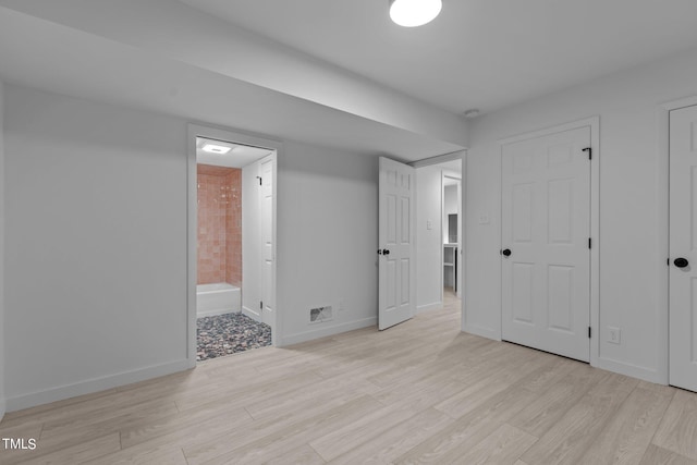 4812 Latimer Rd, Raleigh, NC 27609 - unfurnished bedroom featuring light wood-type flooring and ensuite bath