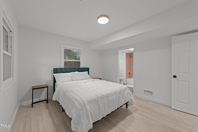 4812 Latimer Rd, Raleigh, NC 27609 - bedroom with light wood-style flooring and connected bathroom