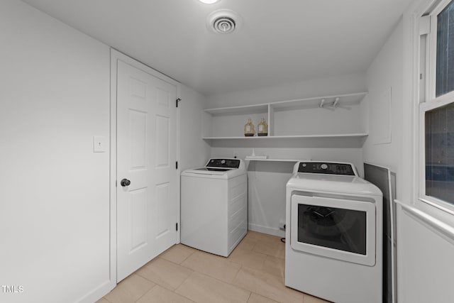 4812 Latimer Rd, Raleigh, NC 27609 - laundry area featuring washer and dryer and light tile patterned flooring