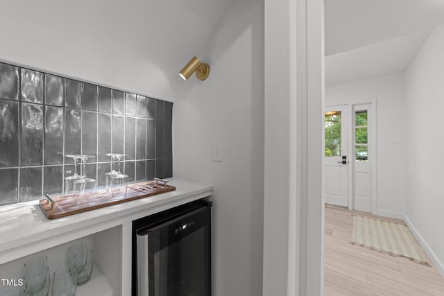 4812 Latimer Rd, Raleigh, NC 27609 - indoor bar with beverage cooler, wood finished floors, and backsplash