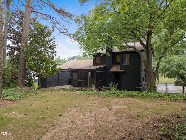 4812 Latimer Rd, Raleigh, NC 27609 - back of house featuring a sunroom and roof with shingles