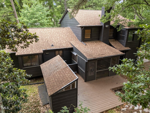 4812 Latimer Rd, Raleigh, NC 27609 - back of house featuring roof with shingles, a chimney, a sunroom, and a deck