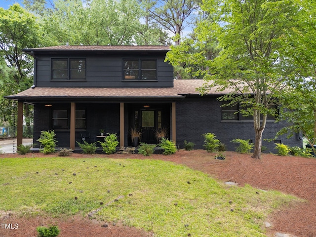 4812 Latimer Rd, Raleigh, NC 27609 - view of front of property featuring a porch, a front yard, roof with shingles, and brick siding