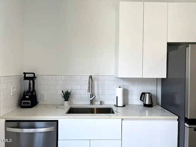1106 Nova St, Durham, NC 27713 - kitchen with appliances with stainless steel finishes, white cabinets, and modern cabinets