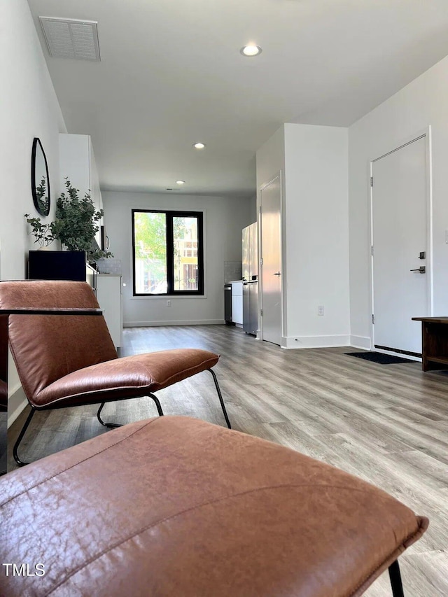 1106 Nova St, Durham, NC 27713 - living room featuring light wood-type flooring and recessed lighting