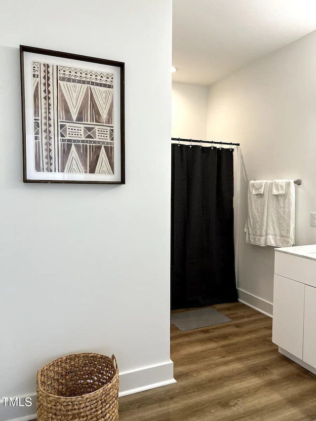 1106 Nova St, Durham, NC 27713 - full bathroom with vanity, wood finished floors, a shower with shower curtain, and recessed lighting