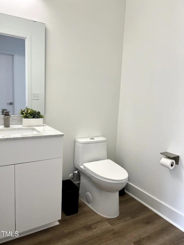 1106 Nova St, Durham, NC 27713 - half bath with vanity and wood finished floors
