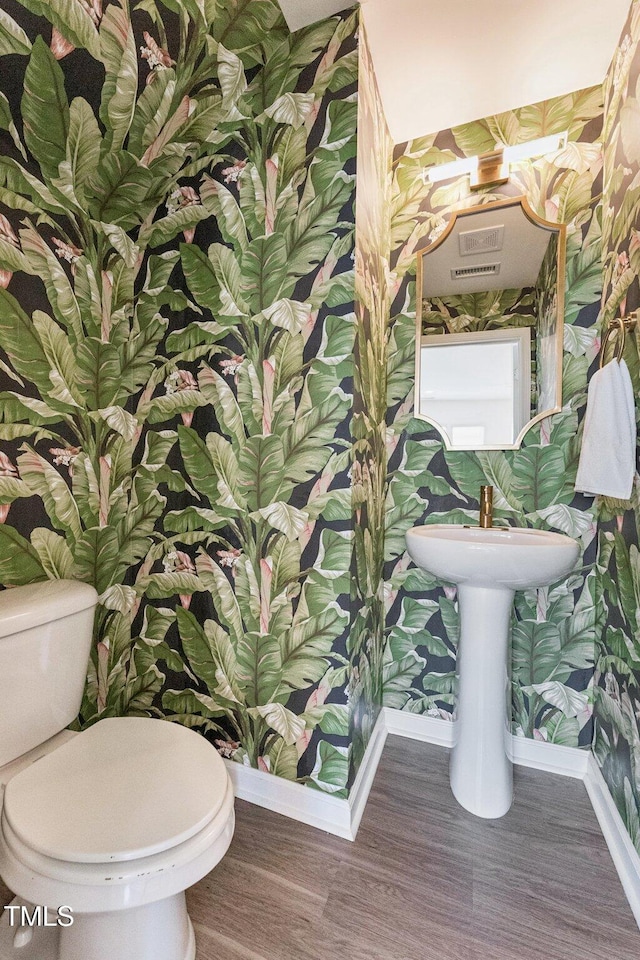3194 Retama Run, New Hill, NC 27562 - half bath featuring wood finished floors and wallpapered walls