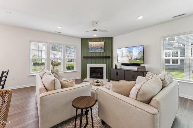 3194 Retama Run, New Hill, NC 27562 - living room with a ceiling fan, dark wood-style flooring, a fireplace, and recessed lighting