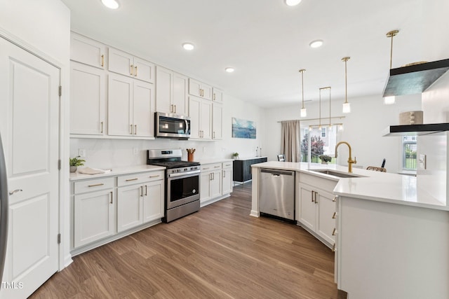3194 Retama Run, New Hill, NC 27562 - kitchen with stainless steel appliances, light wood-style floors, white cabinetry, light countertops, and recessed lighting