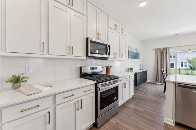 3194 Retama Run, New Hill, NC 27562 - kitchen featuring stainless steel appliances, wood finished floors, white cabinets, and recessed lighting