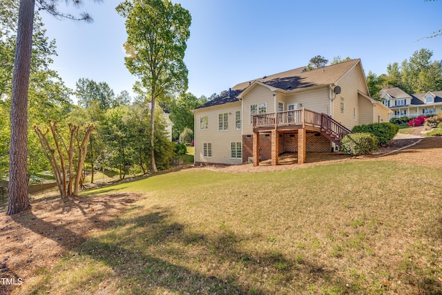 306 Neuse Ridge Dr, Clayton, NC 27527 - rear view of house with a deck, a yard, and stairs