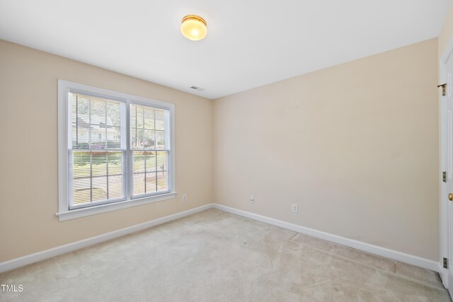 306 Neuse Ridge Dr, Clayton, NC 27527 - unfurnished room featuring baseboards and light carpet