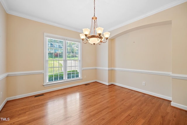 306 Neuse Ridge Dr, Clayton, NC 27527 - spare room with a chandelier, wood finished floors, and ornamental molding