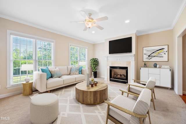 306 Neuse Ridge Dr, Clayton, NC 27527 - living room with healthy amount of natural light, ceiling fan, a tiled fireplace, ornamental molding, and light colored carpet