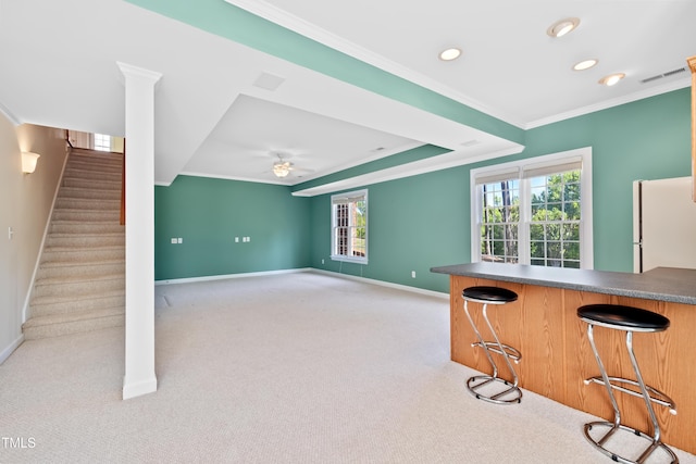 306 Neuse Ridge Dr, Clayton, NC 27527 - bar area with carpet, freestanding refrigerator, ornamental molding, recessed lighting, and stairway
